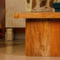 Large wooden coffee table with chevron pattern top and natural wood finish