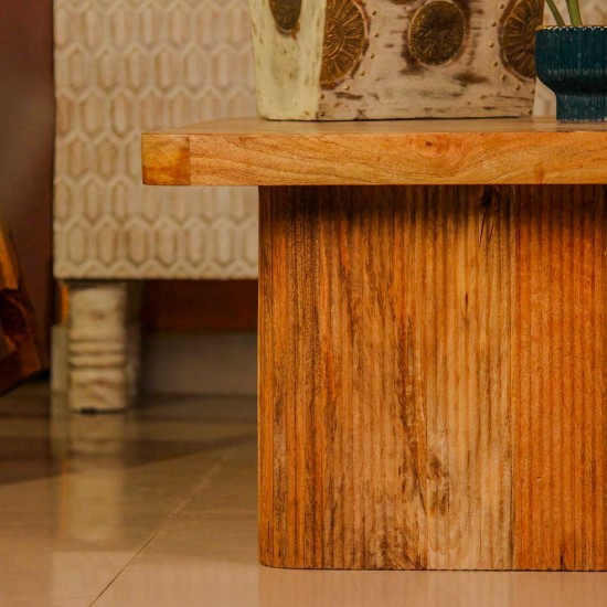 Large wooden coffee table with chevron pattern top and natural wood finish