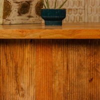 Large wooden coffee table with chevron pattern top and natural wood finish