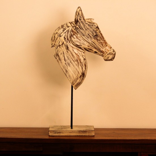 Hand-carved wooden horse head in a distressed whitewash finish, with a flowing textured mane, mounted on a slender black iron stand as a standalone decorative accent.