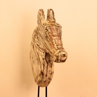 Hand-carved wooden horse head in a distressed whitewash finish, with a flowing textured mane, mounted on a slender black iron stand as a standalone decorative accent.