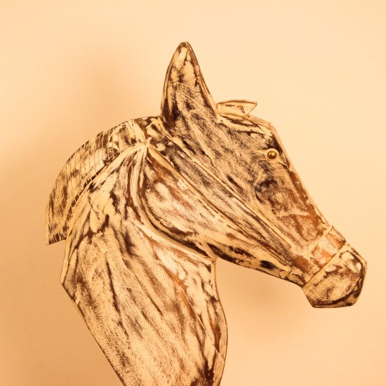 Hand-carved wooden horse head in a distressed whitewash finish, with a flowing textured mane, mounted on a slender black iron stand as a standalone decorative accent.