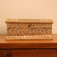 Top view of a wooden tissue box with an oval dispensing cut-out, edged with a white hand-painted floral border and small gold dot accents.