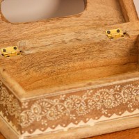 Top view of a wooden tissue box with an oval dispensing cut-out, edged with a white hand-painted floral border and small gold dot accents.