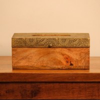 Brass Embossed Sunburst Tissue Box – Top View Top view of a wooden tissue box with a brass-embossed lid in a repeating sunburst and mandala pattern, with an oval dispensing cut-out at the centre.