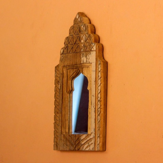 Jharokha Mirror Frame – Natural Wood, Front View Front view of a hand-carved wooden mirror frame in a jharokha arch shape, with a lattice-carved crown and an arched mirror at the centre, hung on an orange wall.