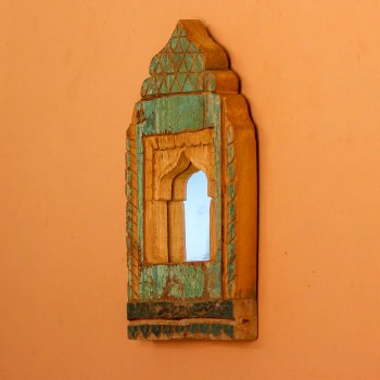 Jharokha Mirror Frame – Green, Styled on Wall Small 13 inch green distressed jharokha mirror frame mounted on an orange wall as a colourful entryway accent.