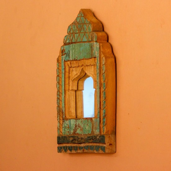 Jharokha Mirror Frame – Green, Styled on Wall Small 13 inch green distressed jharokha mirror frame mounted on an orange wall as a colourful entryway accent.