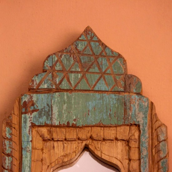 Jharokha Mirror Frame – Green, Styled on Wall Small 13 inch green distressed jharokha mirror frame mounted on an orange wall as a colourful entryway accent.