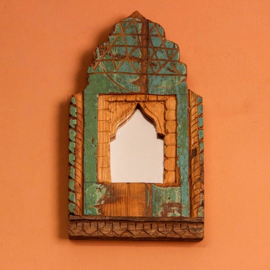 Jharokha Mirror Frame – Rustic Green, Front View Front view of a hand-carved wooden mirror frame in a jharokha arch shape, in weathered green with chipped paint, a lattice-carved crown and an arched mirror at the centre.