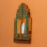 Jharokha Mirror Frame – Rustic Green, Front View Front view of a hand-carved wooden mirror frame in a jharokha arch shape, in weathered green with chipped paint, a lattice-carved crown and an arched mirror at the centre.