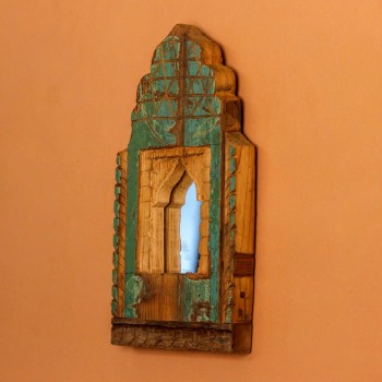 Jharokha Mirror Frame – Rustic Green, Front View Front view of a hand-carved wooden mirror frame in a jharokha arch shape, in weathered green with chipped paint, a lattice-carved crown and an arched mirror at the centre.