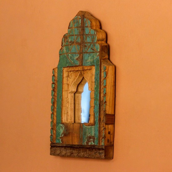 Jharokha Mirror Frame – Rustic Green, Front View Front view of a hand-carved wooden mirror frame in a jharokha arch shape, in weathered green with chipped paint, a lattice-carved crown and an arched mirror at the centre.