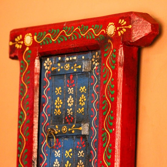 Hand Painted Blue & Red Wooden Jharokha Wall Decor Small wooden window-shaped wall decor piece hand painted in deep red frame with a blue inner panel, featuring fine traditional motifs across the surface.