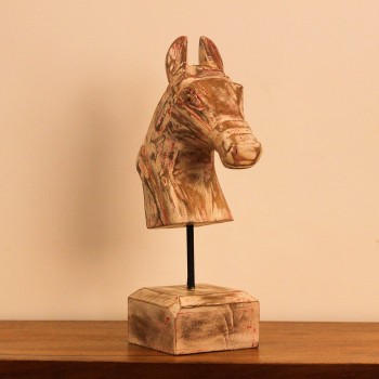 Rustic pink-streaked wooden horse head sculpture on a stand, styled on a wooden console as a tabletop accent.