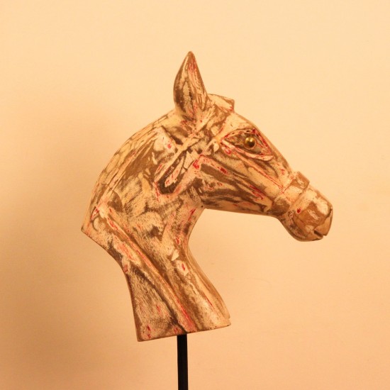 Rustic Pink Horse Head Sculpture Styled on Console Rustic pink-streaked wooden horse head sculpture on a stand, styled on a wooden console as a tabletop accent.