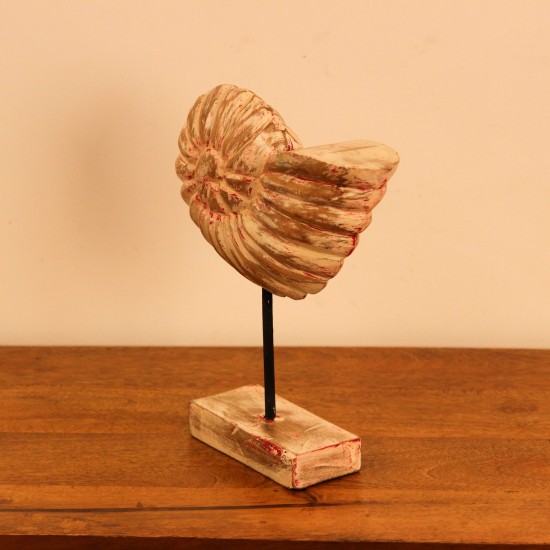 Carved Wooden Ammonite Shell Sculpture Hand-carved wooden sculpture shaped after a spiral ammonite fossil, showing ridged chamber detailing along its curve, mounted upright on a compact stand.