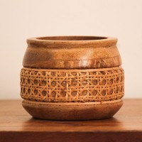 Cane Bowl – Small, Front View Front view of a small round wooden bowl with a flared rim and a woven cane band around its middle, set on a rounded wooden base.