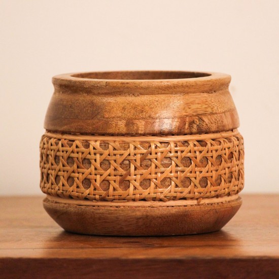 Cane Bowl – Small, Front View Front view of a small round wooden bowl with a flared rim and a woven cane band around its middle, set on a rounded wooden base.