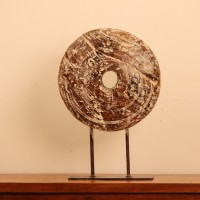 White Distressed Wooden Wheel Décor on Stand – Styled on Console White distressed wooden wheel on stand styled on a console as table décor