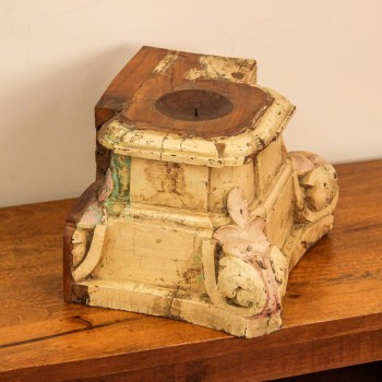 Rustic white wooden candle stand styled on a wooden table