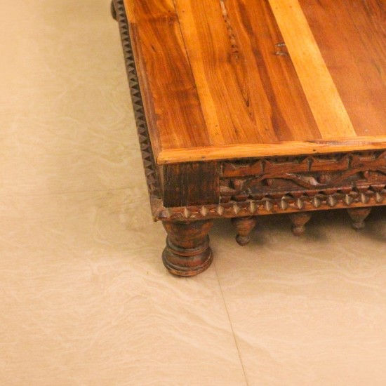 Large Carved Solid Wood Bajot with Hanging Lattu – Styled on Floor Large solid wood bajot styled on the floor in front of a wooden sideboard with colourful drawers