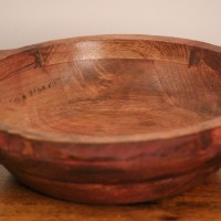 Small Solid Wood Fruit Bowl with Handles – Rustic Red – Styled on Table Small rustic red solid wood fruit bowl styled on a polished wooden console table