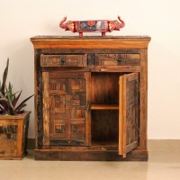 Reclaimed Sleeper Wood Cabinet with Drawers – Styled in Room Reclaimed sleeper wood cabinet styled in a living room beside a plant, with a painted décor piece on top
