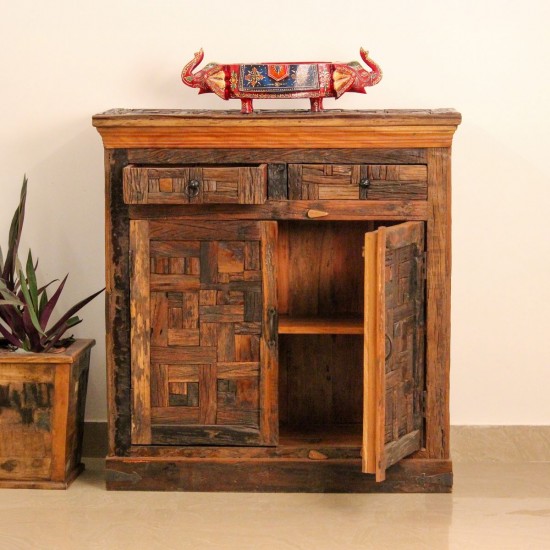 Reclaimed Sleeper Wood Cabinet with Drawers – Styled in Room Reclaimed sleeper wood cabinet styled in a living room beside a plant, with a painted décor piece on top