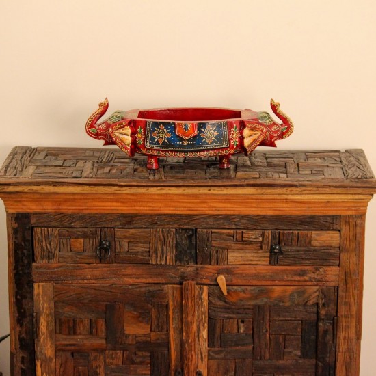 Reclaimed Sleeper Wood Cabinet with Drawers – Styled in Room Reclaimed sleeper wood cabinet styled in a living room beside a plant, with a painted décor piece on top