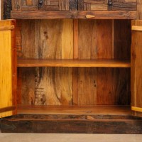Reclaimed Sleeper Wood Cabinet with Drawers – Styled in Room Reclaimed sleeper wood cabinet styled in a living room beside a plant, with a painted décor piece on top
