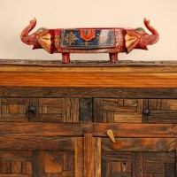 Reclaimed Sleeper Wood Cabinet with Drawers – Styled in Room Reclaimed sleeper wood cabinet styled in a living room beside a plant, with a painted décor piece on top