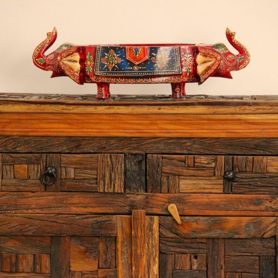 Reclaimed Sleeper Wood Cabinet with Drawers – Styled in Room Reclaimed sleeper wood cabinet styled in a living room beside a plant, with a painted décor piece on top