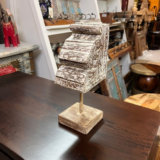 Small distressed white hand carved wooden block mounted on iron stand for vintage tabletop decor