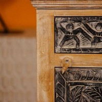 Hand-carved tribal art wooden bedside cabinet with intricate carvings