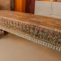 Antique finish carved wooden bench with detailed floral and geometric motifs