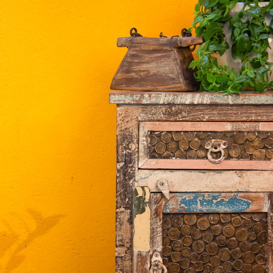 Ethnic style coin-inlay bedside nightstand – front drawer view Ethnic style coin-inlay bedside nightstand – front drawer view