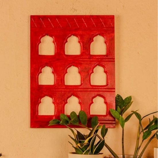 Rich red handcrafted wall decor with nine arch cutouts, designed to create a bold and traditional statement.