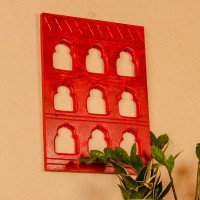 Rich red handcrafted wall decor with nine arch cutouts, designed to create a bold and traditional statement.
