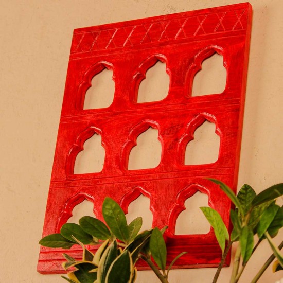 Rich red handcrafted wall decor with nine arch cutouts, designed to create a bold and traditional statement.