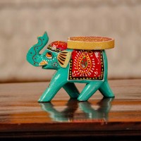 Small handpainted teal green elephant figurine with vibrant red and yellow detailing, designed in traditional Indian folk art style.