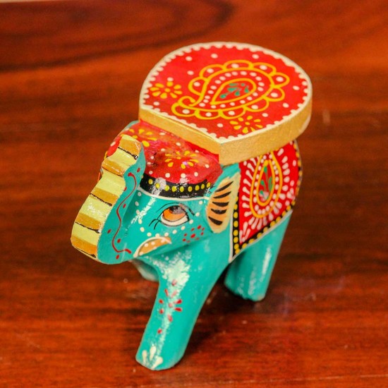 Small handpainted teal green elephant figurine with vibrant red and yellow detailing, designed in traditional Indian folk art style.