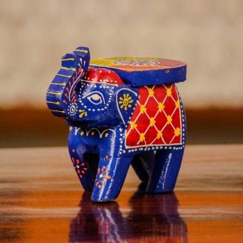 Small handpainted blue elephant figurine with vibrant red and yellow detailing, designed in traditional Indian folk art style.