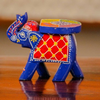 Small handpainted blue elephant figurine with vibrant red and yellow detailing, designed in traditional Indian folk art style.