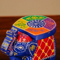 Handpainted Blue Elephant Decor Small handpainted blue elephant figurine with vibrant red and yellow detailing, designed in traditional Indian folk art style.