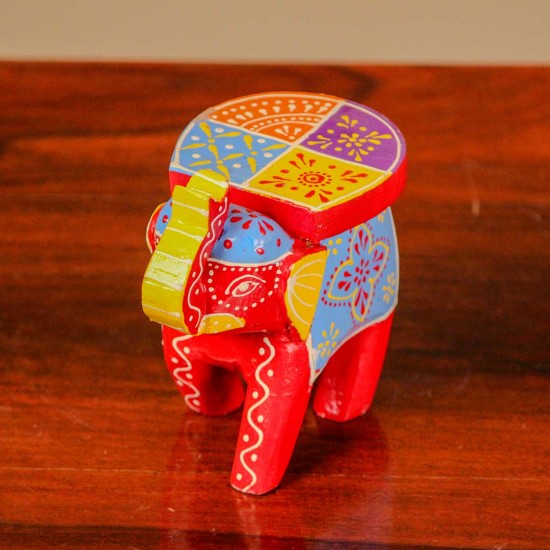Small handpainted red elephant figurine with vibrant traditional patterns, crafted in Indian folk art style.