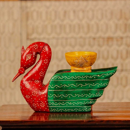 Decorative wooden duck in red and green finish with handpainted patterns and a small holder on top for table styling.