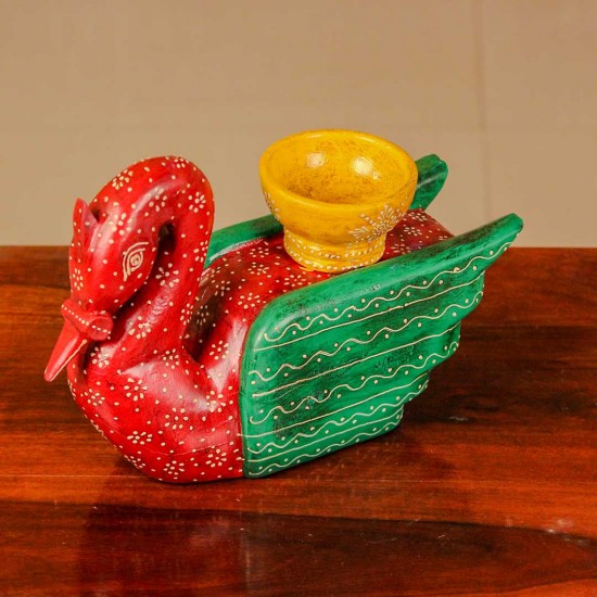 Decorative wooden duck in red and green finish with handpainted patterns and a small holder on top for table styling.