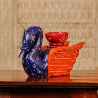 Decorative wooden duck in blue and orange finish with intricate handpainted patterns and a utility holder on top.