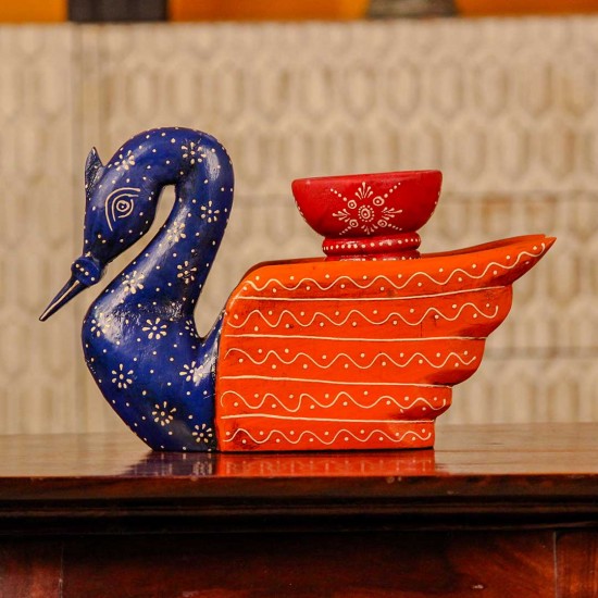 Decorative wooden duck in blue and orange finish with intricate handpainted patterns and a utility holder on top.